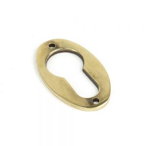 From the Anvil Aged Brass Oval Euro Escutcheon - 83819