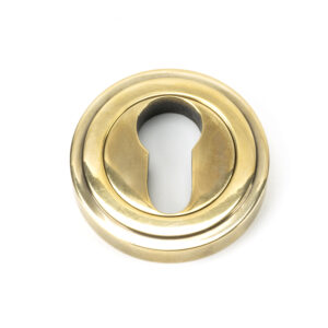 From the Anvil - Aged Brass Round Euro Escutcheon (Art Deco) - 45708